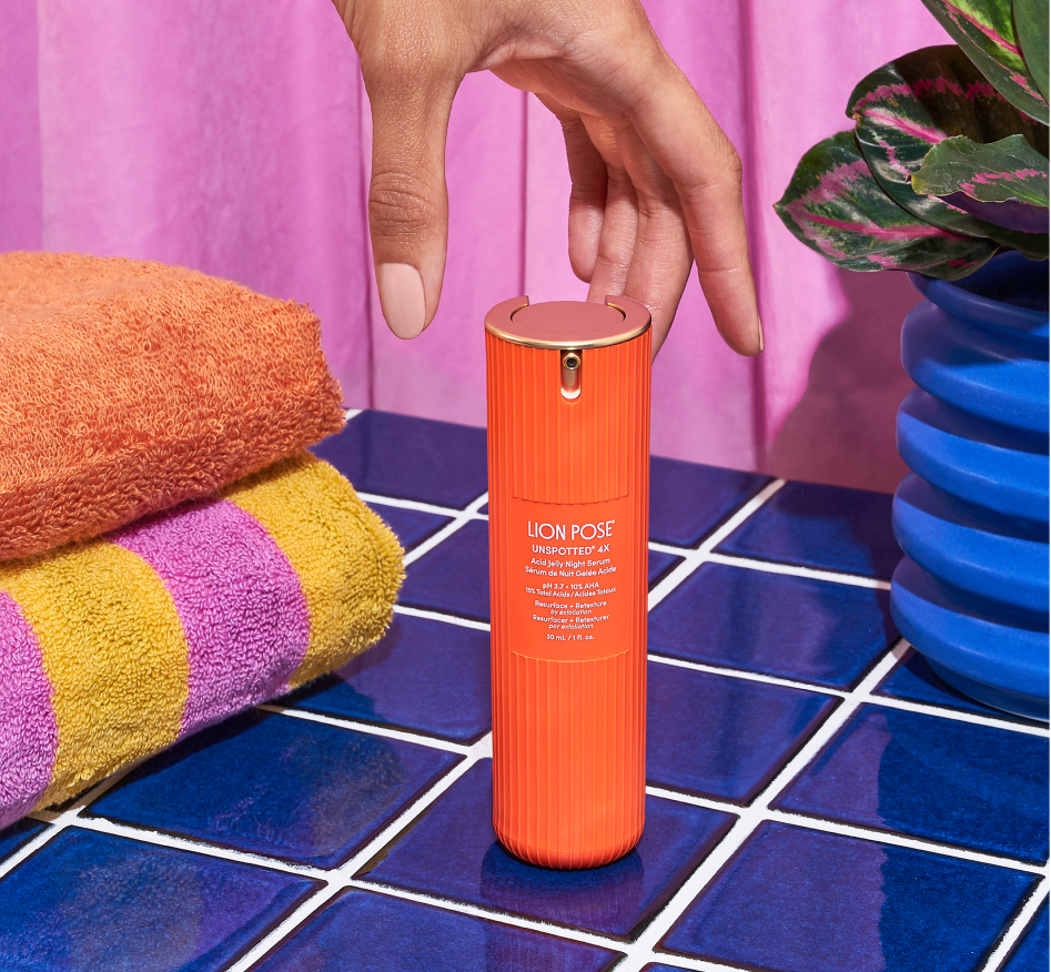 Lion Pose UNSPOTTED 4X Acid Jelly Night Serum in a clean aesthetic setting, highlighting a multi-acid night serum formulated to visibly correct hyperpigmentation.